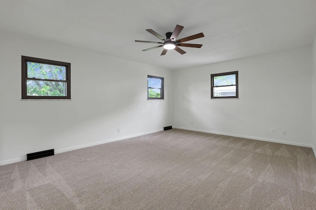 1883 Fairhaven Rd, Columbus, OH 43229 - unfurnished room with light colored carpet, a ceiling fan, and baseboards