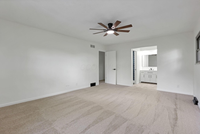 1883 Fairhaven Rd, Columbus, OH 43229 - unfurnished bedroom with light carpet, baseboards, ensuite bath, and ceiling fan
