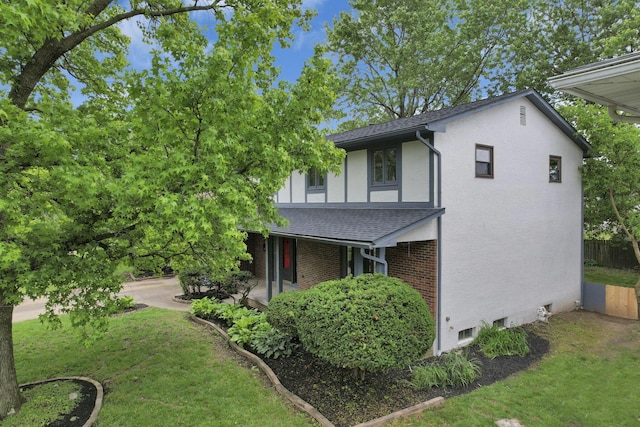 1883 Fairhaven Rd, Columbus, OH 43229 - view of home's exterior featuring stucco siding, a porch, and a shingled roof
