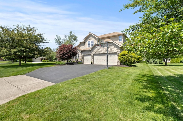 4008 Ryleland Ct, Powell, OH 43065 - view of front of home featuring stone siding, asphalt driveway, a front lawn, and a garage