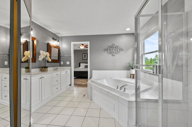 4008 Ryleland Ct, Powell, OH 43065 - bathroom featuring ceiling fan, vanity, a garden tub, tile patterned flooring, and recessed lighting