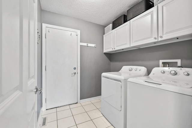 4008 Ryleland Ct, Powell, OH 43065 - laundry area featuring cabinet space, washing machine and dryer, light tile patterned floors, and baseboards