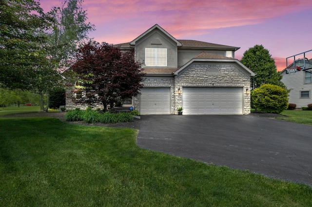 4008 Ryleland Ct, Powell, OH 43065 - traditional-style house with driveway, stucco siding, stone siding, and a lawn