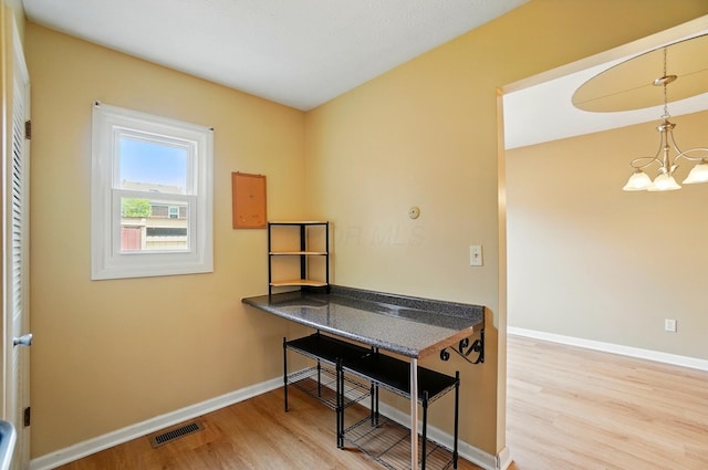 662 Pamlico St Unit Z7, Columbus, OH 43228 - office space with a chandelier, wood finished floors, and baseboards