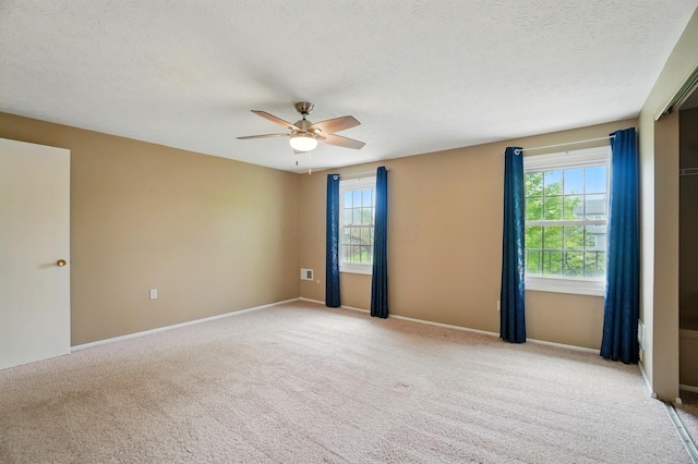 662 Pamlico St Unit Z7, Columbus, OH 43228 - unfurnished room with ceiling fan, light colored carpet, a textured ceiling, and baseboards
