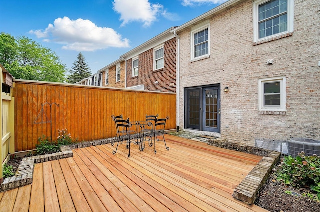 662 Pamlico St Unit Z7, Columbus, OH 43228 - wooden deck with central air condition unit, fence, and outdoor dining area