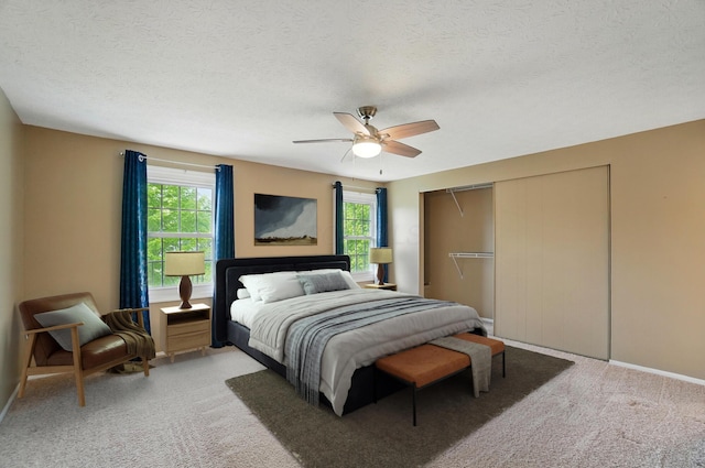 662 Pamlico St Unit Z7, Columbus, OH 43228 - bedroom with multiple windows, a closet, light colored carpet, baseboards, and a textured ceiling