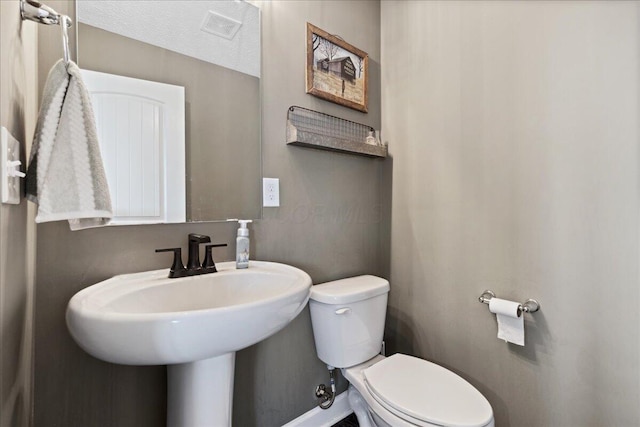 2460 N Court St, Circleville, OH 43113 - bathroom with toilet and baseboards