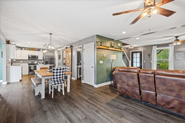 2460 N Court St, Circleville, OH 43113 - dining space featuring ceiling fan, dark wood-style flooring, stairs, baseboards, and recessed lighting