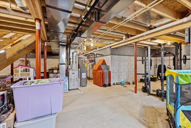 2460 N Court St, Circleville, OH 43113 - unfinished basement featuring water heater and concrete block wall