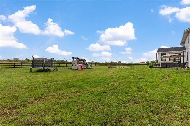 2460 N Court St, Circleville, OH 43113 - view of yard with a trampoline, a playground, and a view of rural / pastoral area