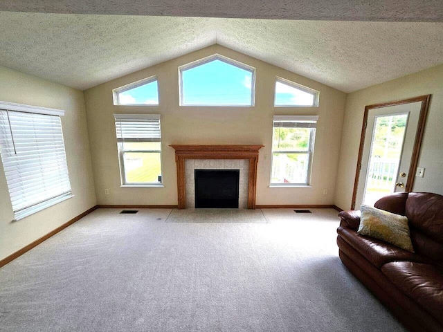 464 Highbanks Valley Dr, Newark, OH 43055 - living area featuring baseboards, a high end fireplace, light colored carpet, lofted ceiling, and a textured ceiling