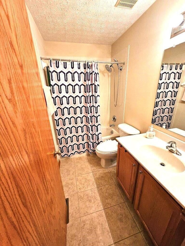 464 Highbanks Valley Dr, Newark, OH 43055 - bathroom featuring vanity, toilet, shower / tub combo with curtain, tile patterned flooring, and a textured ceiling