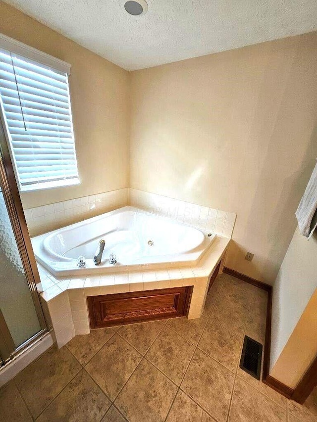 464 Highbanks Valley Dr, Newark, OH 43055 - full bathroom with a textured ceiling, tile patterned flooring, a stall shower, and a bath
