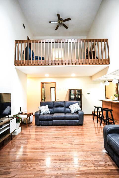 532 Woodview Rd, Westerville, OH 43081 - living room featuring a towering ceiling, wood finished floors, and ceiling fan
