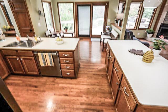 532 Woodview Rd, Westerville, OH 43081 - kitchen with wood finished floors, stainless steel dishwasher, brown cabinets, and light countertops
