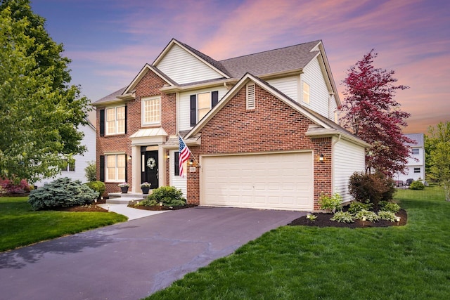 4381 Grathrine Ct, Lewis Center, OH 43035 - colonial inspired home featuring driveway, an attached garage, a lawn, brick siding, and roof with shingles