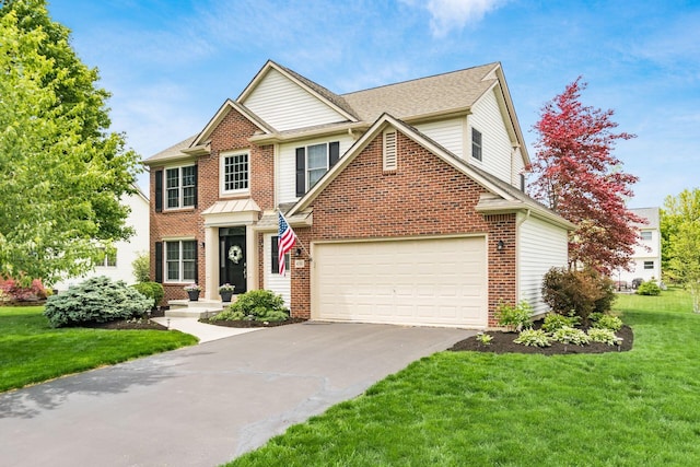4381 Grathrine Ct, Lewis Center, OH 43035 - view of front of house featuring concrete driveway, a front yard, brick siding, and an attached garage