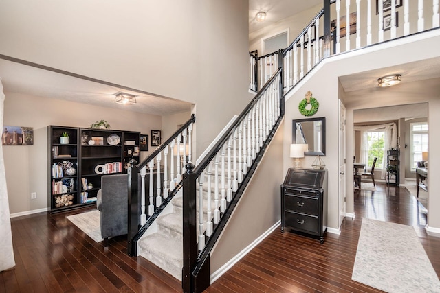 4381 Grathrine Ct, Lewis Center, OH 43035 - staircase with hardwood / wood-style floors, baseboards, and a towering ceiling