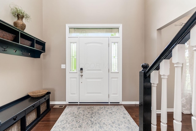 4381 Grathrine Ct, Lewis Center, OH 43035 - foyer entrance featuring dark wood-style flooring, stairs, and baseboards