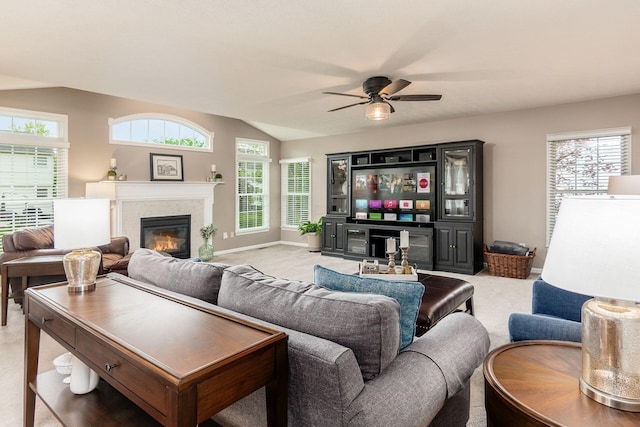 4381 Grathrine Ct, Lewis Center, OH 43035 - living area with a glass covered fireplace, ceiling fan, carpet flooring, lofted ceiling, and baseboards