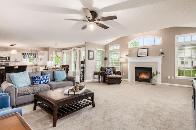 4381 Grathrine Ct, Lewis Center, OH 43035 - living area featuring plenty of natural light, ceiling fan, a fireplace, baseboards, and lofted ceiling