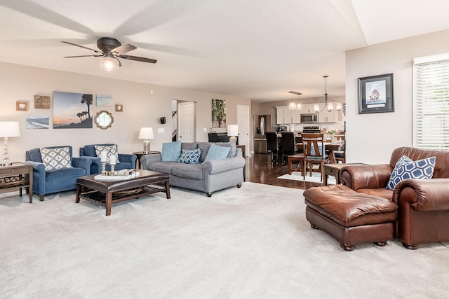 4381 Grathrine Ct, Lewis Center, OH 43035 - living room with light carpet, a ceiling fan, and a chandelier
