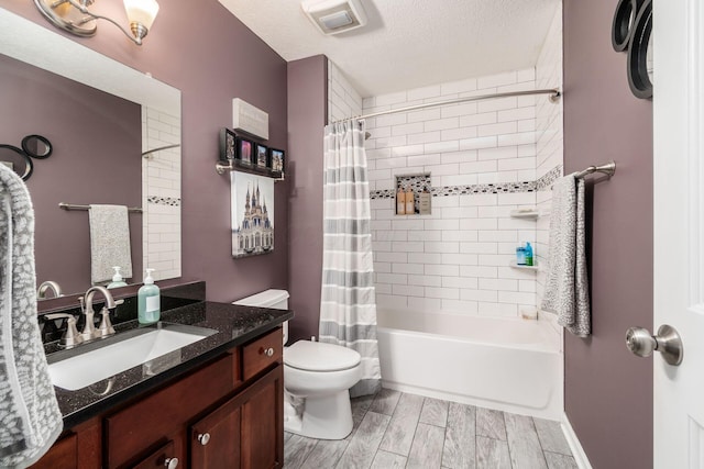 4381 Grathrine Ct, Lewis Center, OH 43035 - bathroom featuring toilet, shower / bath combination with curtain, vanity, and a textured ceiling