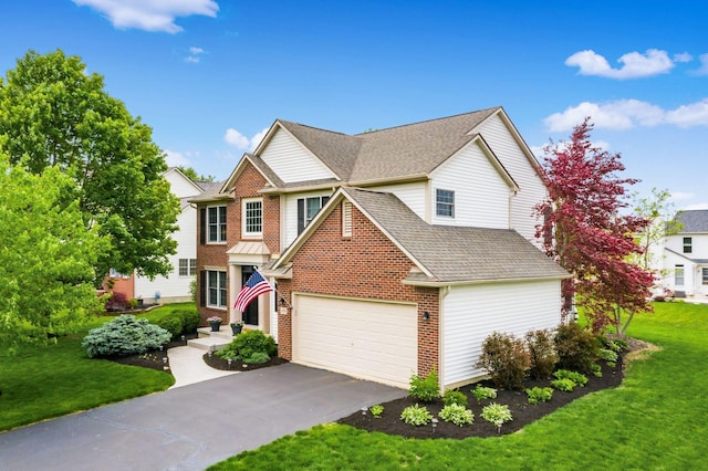 4381 Grathrine Ct, Lewis Center, OH 43035 - traditional-style house with a front lawn, asphalt driveway, roof with shingles, and a garage
