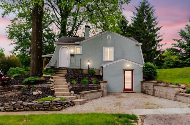 651 Eastern Ave, Bellefontaine, OH 43311 - view of front of property featuring a patio and stucco siding
