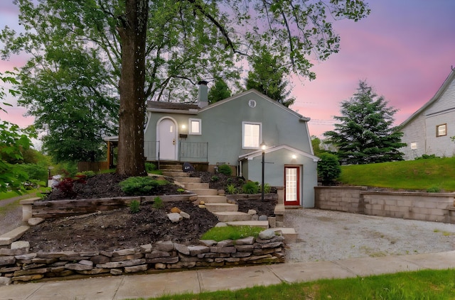 651 Eastern Ave, Bellefontaine, OH 43311 - view of front of home featuring stucco siding and a chimney