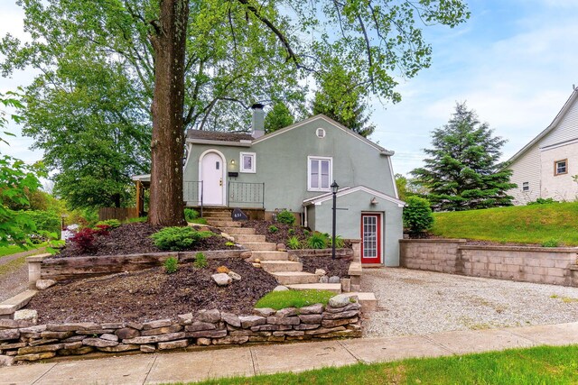 651 Eastern Ave, Bellefontaine, OH 43311 - view of front of house with stucco siding