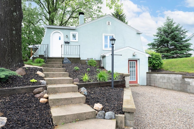 651 Eastern Ave, Bellefontaine, OH 43311 - view of front of property with a chimney and stucco siding