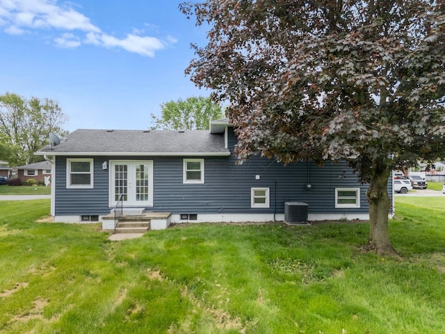 86 Arlington Ave, London, OH 43140 - back of house with french doors, a yard, cooling unit, and a shingled roof