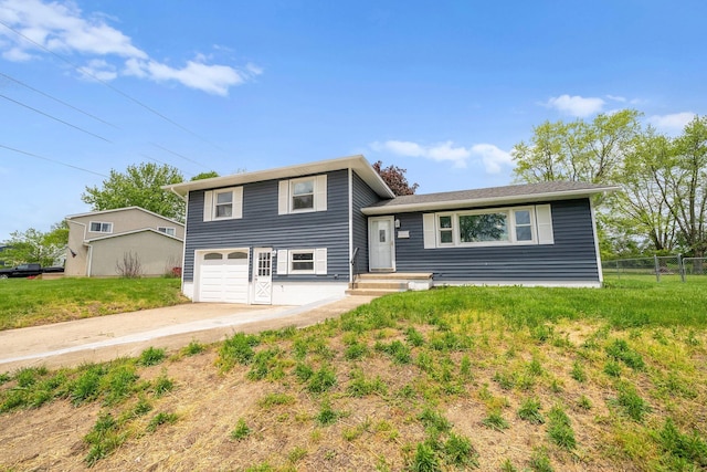 86 Arlington Ave, London, OH 43140 - split level home featuring concrete driveway and a garage