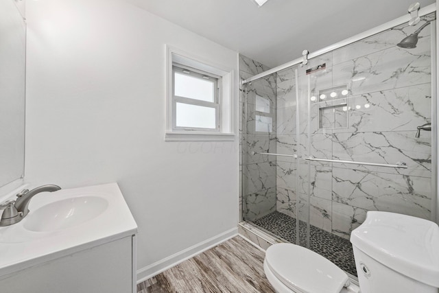 86 Arlington Ave, London, OH 43140 - full bath with toilet, vanity, wood finished floors, a marble finish shower, and baseboards