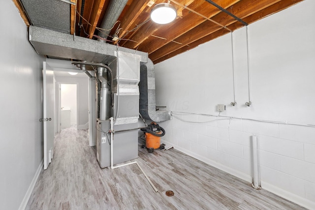 86 Arlington Ave, London, OH 43140 - unfinished below grade area featuring wood finished floors and heating unit