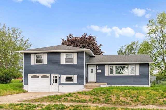 86 Arlington Ave, London, OH 43140 - tri-level home with an attached garage, concrete driveway, and a shingled roof