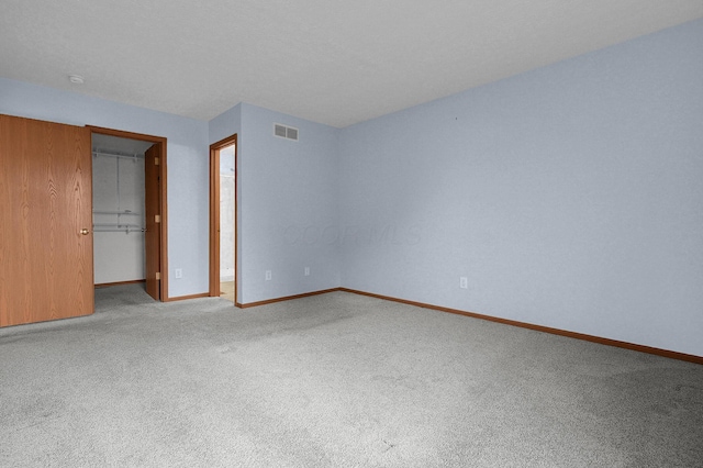 7209 Oliver Winchester Dr, Canal Winchester, OH 43110 - unfurnished bedroom with carpet, a spacious closet, baseboards, and a closet