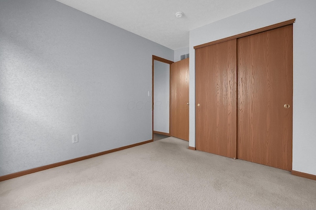 7209 Oliver Winchester Dr, Canal Winchester, OH 43110 - unfurnished bedroom featuring carpet flooring, a closet, and baseboards