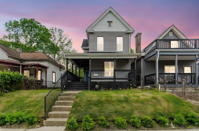 581 Kelton Ave, Columbus, OH 43205 - view of front of home featuring covered porch and a yard