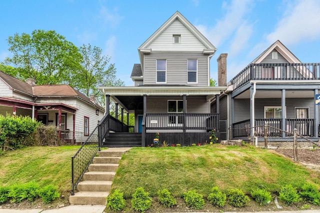 581 Kelton Ave, Columbus, OH 43205 - view of front of house with a front lawn and covered porch