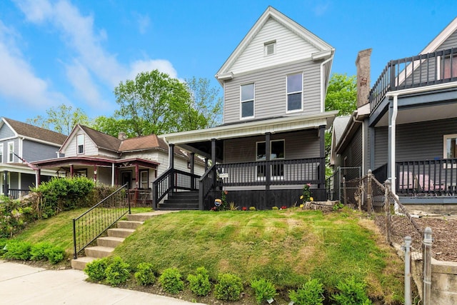 581 Kelton Ave, Columbus, OH 43205 - view of front facade featuring a porch, a front lawn, and stairway