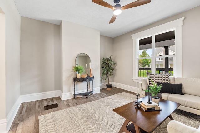 581 Kelton Ave, Columbus, OH 43205 - living room featuring wood finished floors, ceiling fan, and baseboards