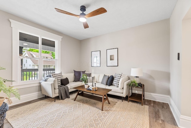 581 Kelton Ave, Columbus, OH 43205 - living room featuring light wood finished floors, baseboards, and ceiling fan