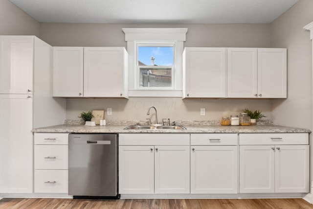 581 Kelton Ave, Columbus, OH 43205 - kitchen featuring dishwasher, a sink, and white cabinets
