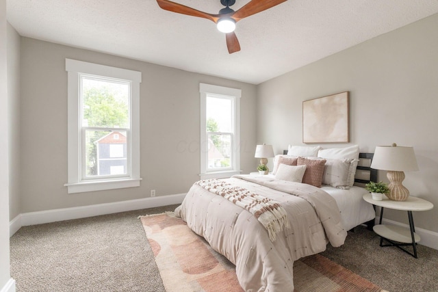 581 Kelton Ave, Columbus, OH 43205 - bedroom with multiple windows, light colored carpet, and baseboards