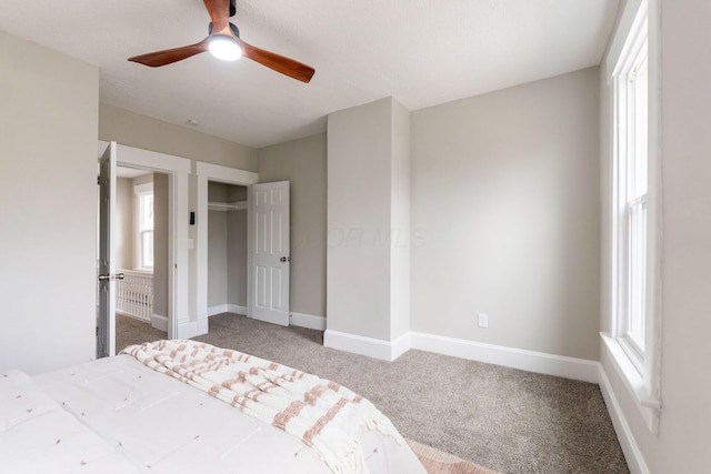581 Kelton Ave, Columbus, OH 43205 - unfurnished bedroom with carpet, baseboards, and a ceiling fan