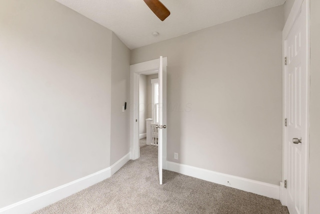 581 Kelton Ave, Columbus, OH 43205 - unfurnished bedroom featuring light carpet, baseboards, and a ceiling fan