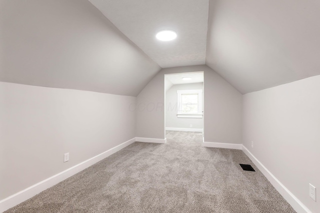 581 Kelton Ave, Columbus, OH 43205 - bonus room with carpet floors, vaulted ceiling, and baseboards